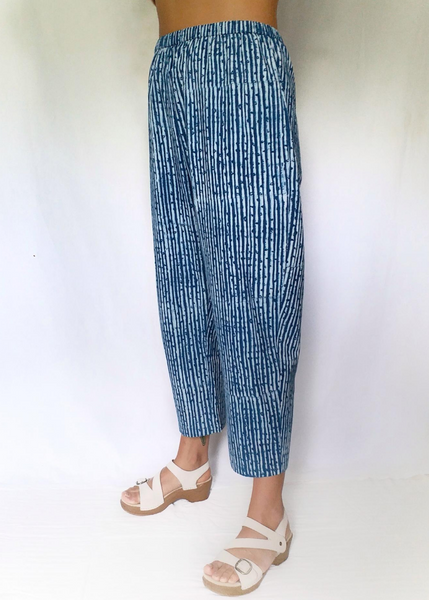 Indigo and white danda stripe print pant. Cinched waste. Sits at the ankles.